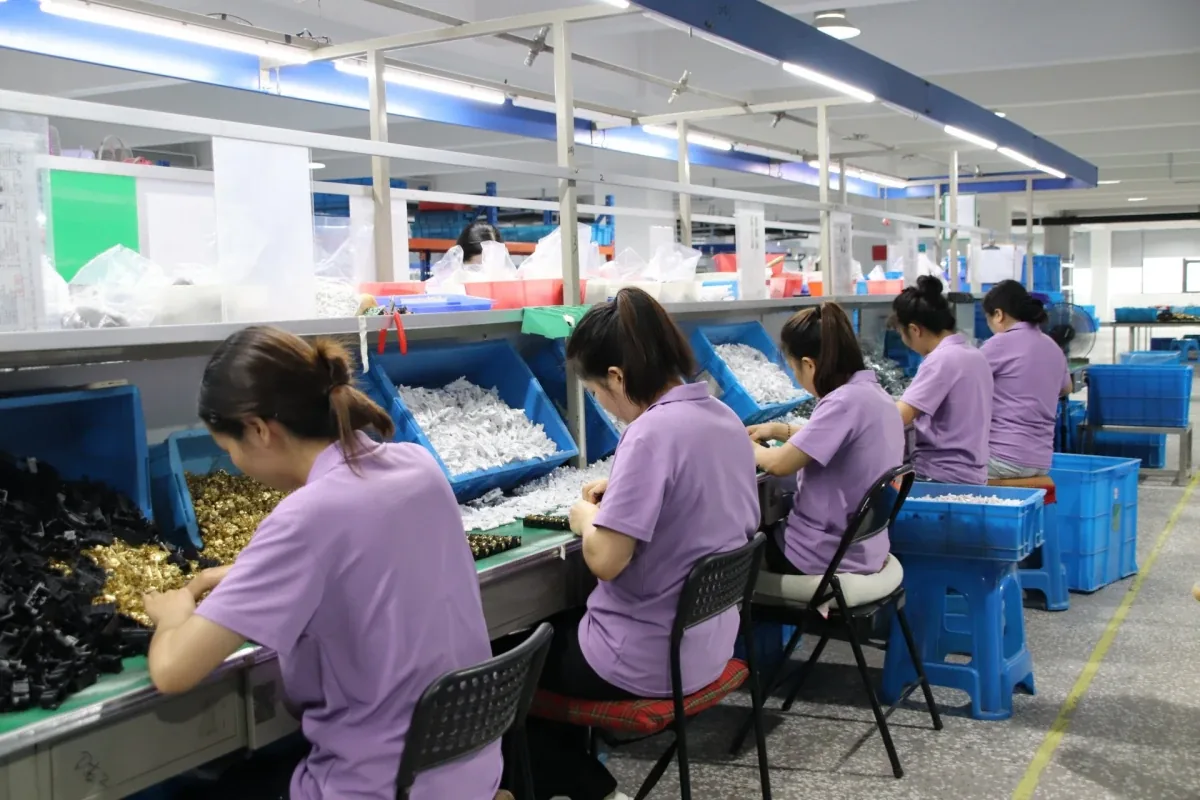 Assembly floor — operators at the wiring device stations